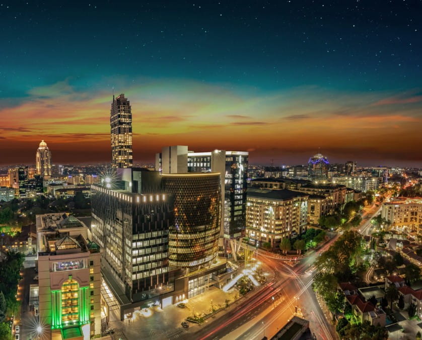 South African investment portfolio outlook with Johannesburg skyline and city infrastructure